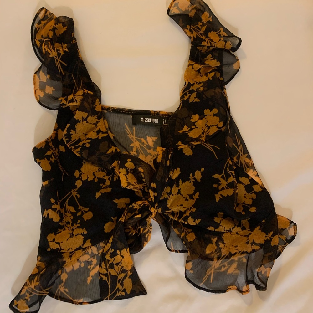 Misguided going out top. Sheer throughout besides chest.  medium.